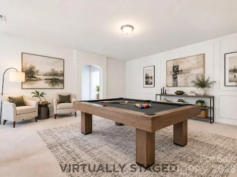 Virtually staged as a game room, the second-level loft offers the flexibility to become a media space, home office, playroom, or an additional relaxed gathering space