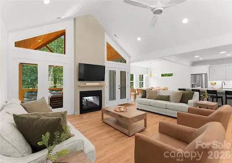 The living room flows into the dining area and kitchen, creating a welcoming space to gather after a day on the lake.