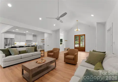 Warm wood floors and an open layout connect the main living spaces, offering plenty of room to relax or host guests.