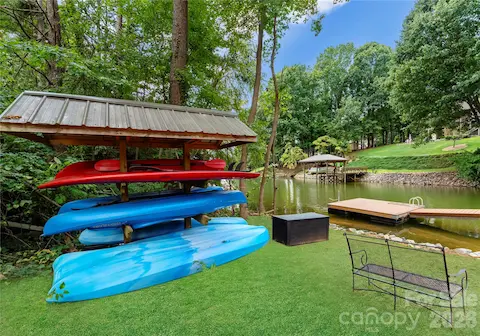 A covered rack keeps kayaks close to the shoreline and ready for time on the water.