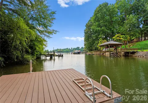 Step onto the dock to take in the quiet cove and the wider lake beyond.